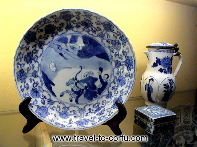 MUSEUM OF ASIAN ART - A porcelain plate and a vase with paintings
of the traditional life in China.