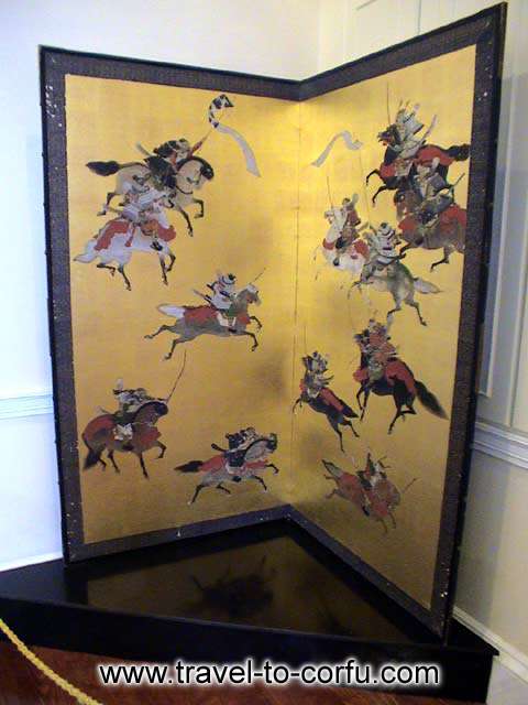 MUSEUM OF ASIAN ART - A folding screen with a painting that represents a battle.